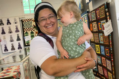 Franciscan-Sister-Concepcion-with-child-at-Catholic-Ecology-Center