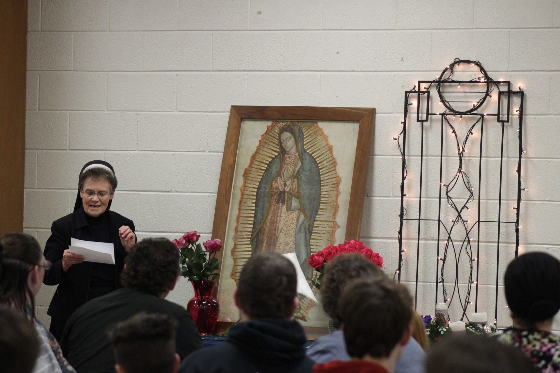 1_Sister-Pam-reads-for-prayer-on-Our-Lady-of-Guadalupe-with-families